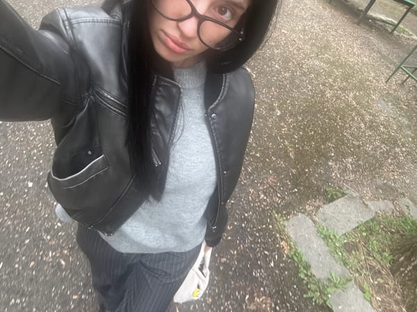 Person takes selfie outdoors in Sofia wearing leather jacket