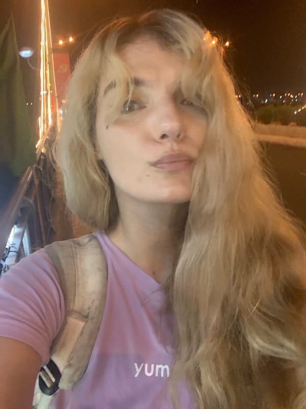 Nighttime selfie in Nha Trang with city backdrop