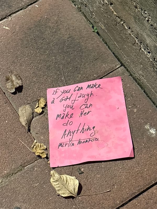 Pink sticky note with Marilyn Monroe quote found on Israeli sidewalk