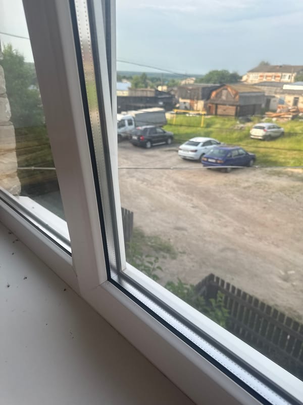 Window views of rural Russian village life in Krasnye Baki