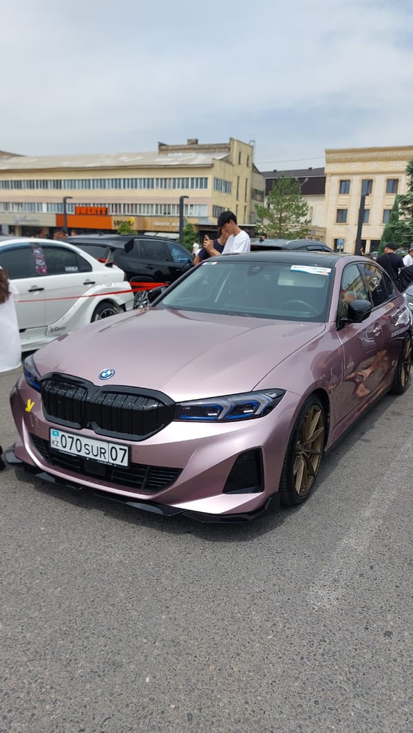 Car show features vintage and modified vehicles in Taraz