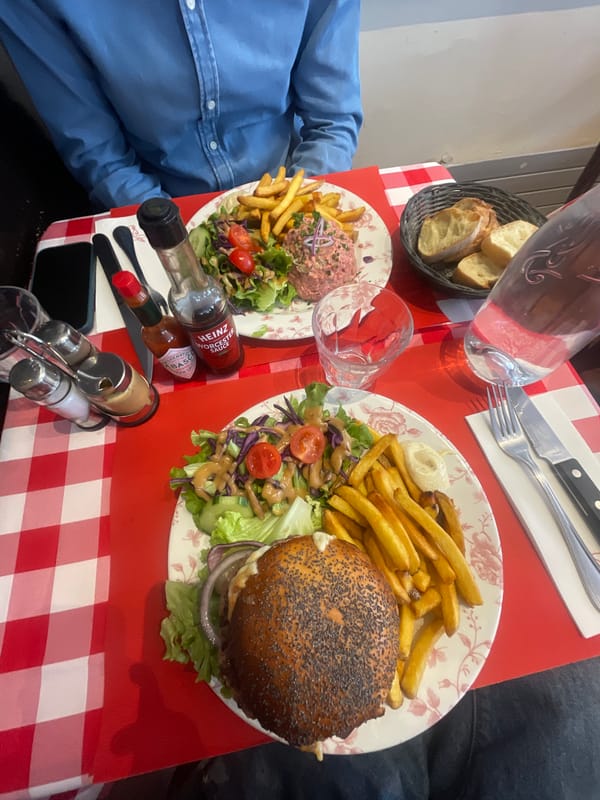 Parisian restaurant meal documented with sundaes and checkered tablecloth