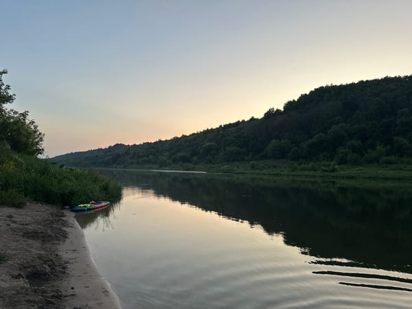 Dusk settles over a quiet river near Alekseevka
