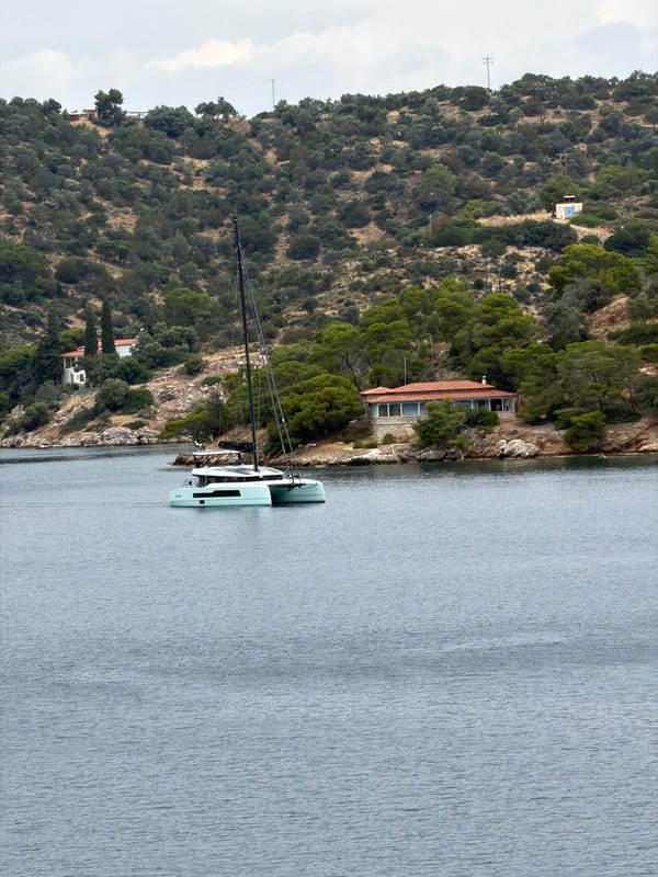 Boats dock at Agios Nektarios coastline, Greece
