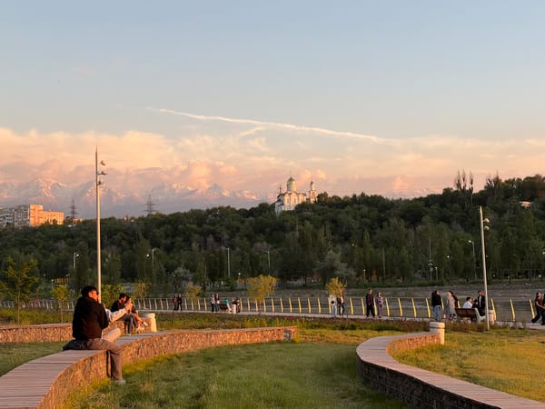 Young people gather at sunset in Almaty park