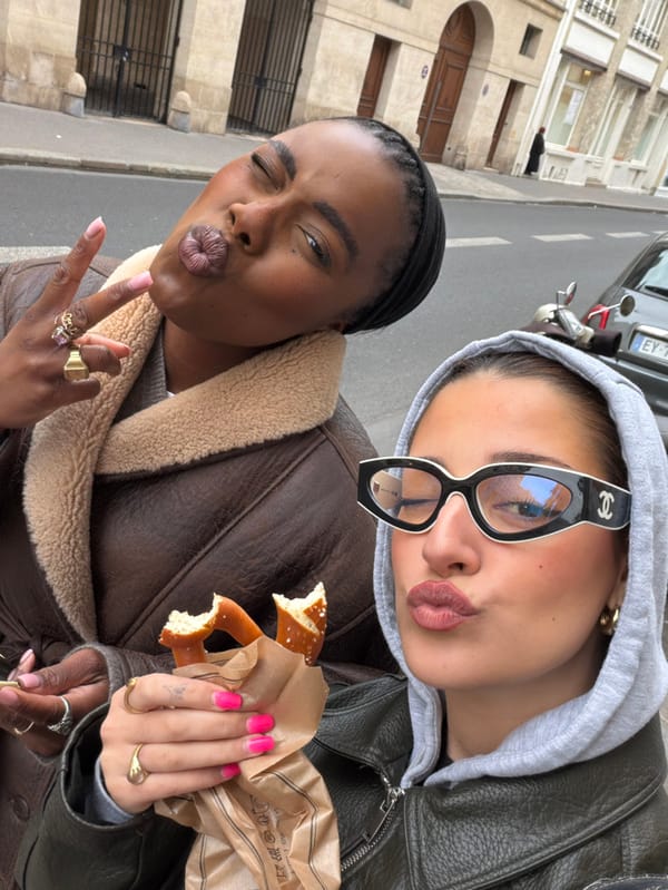 Selfie moment captured on Paris street amid typical architecture