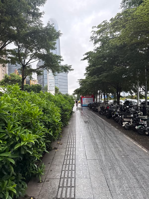 Haizhu District on a rainy commute morning, streets in motion