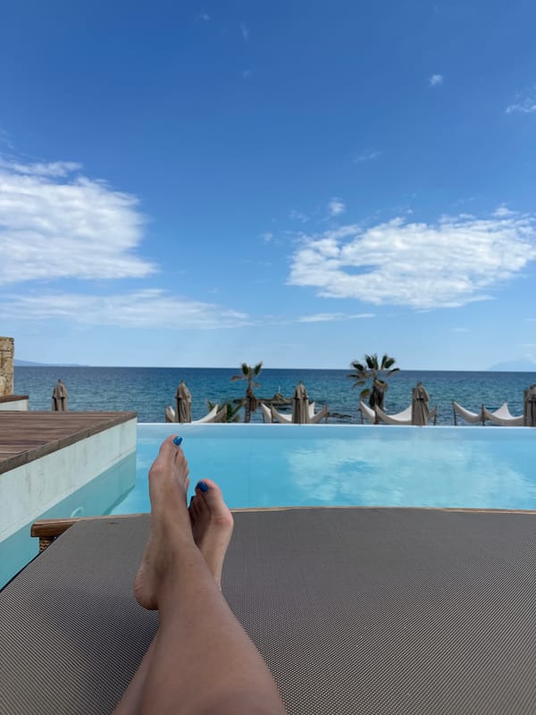 Pool day leisure time captured at Greek infinity pool