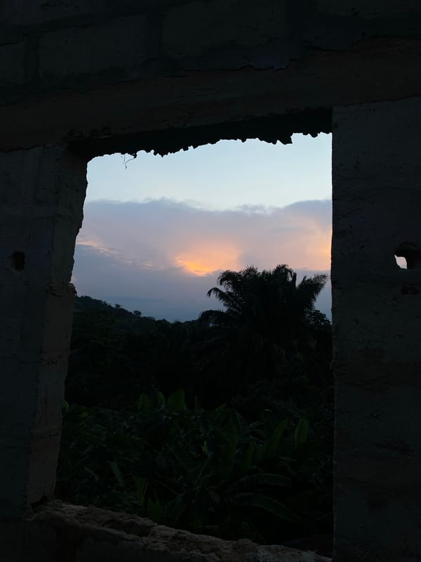 Evening sky viewed through unfinished building in Achara, Nigeria
