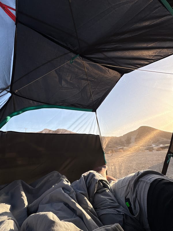 Person rests in camping tent in Arad, Israel