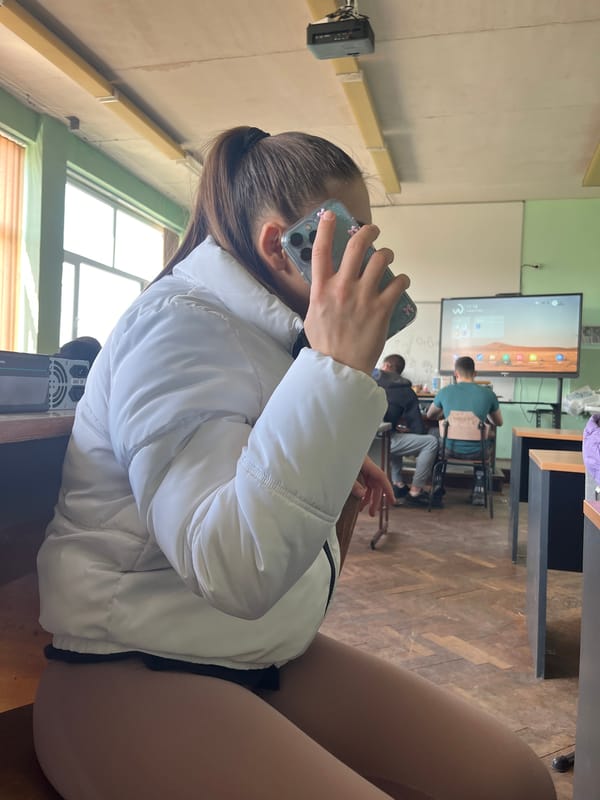 Students snack in Bulgarian classroom during morning session