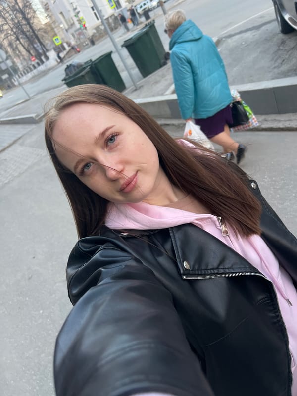 Woman takes mirror selfies on Perm street