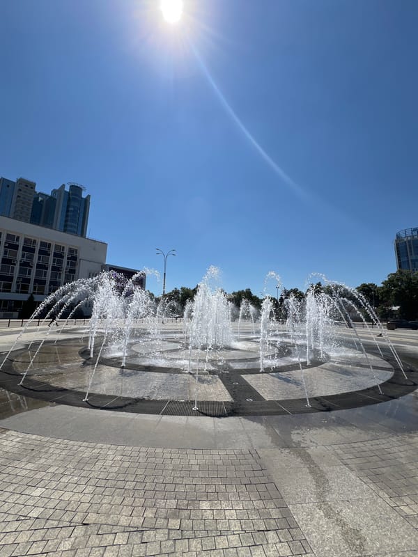 Krasnodar plaza fountain draws a crowd on a sunny summer day