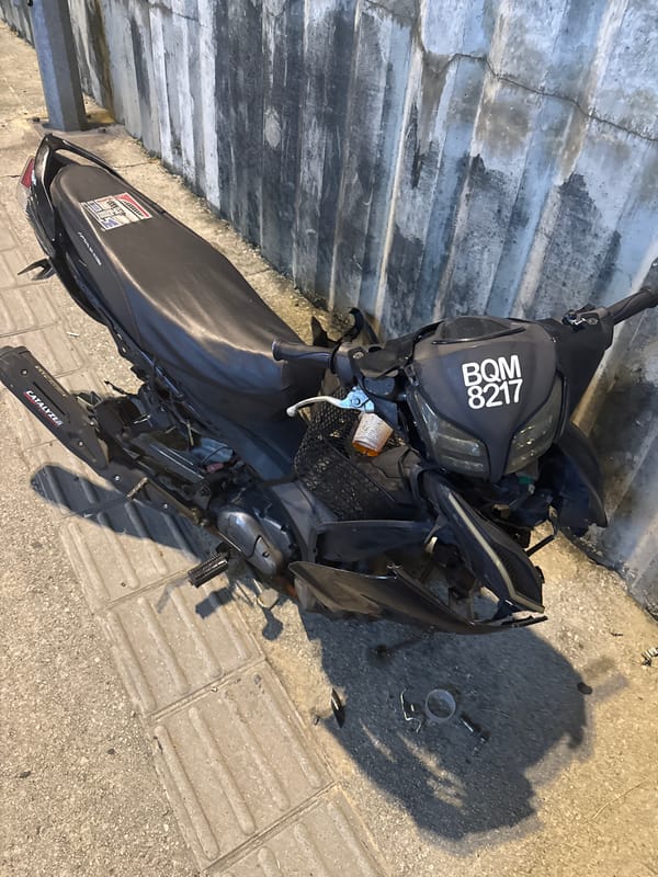 Damaged scooter found on sidewalk in Kuala Lumpur