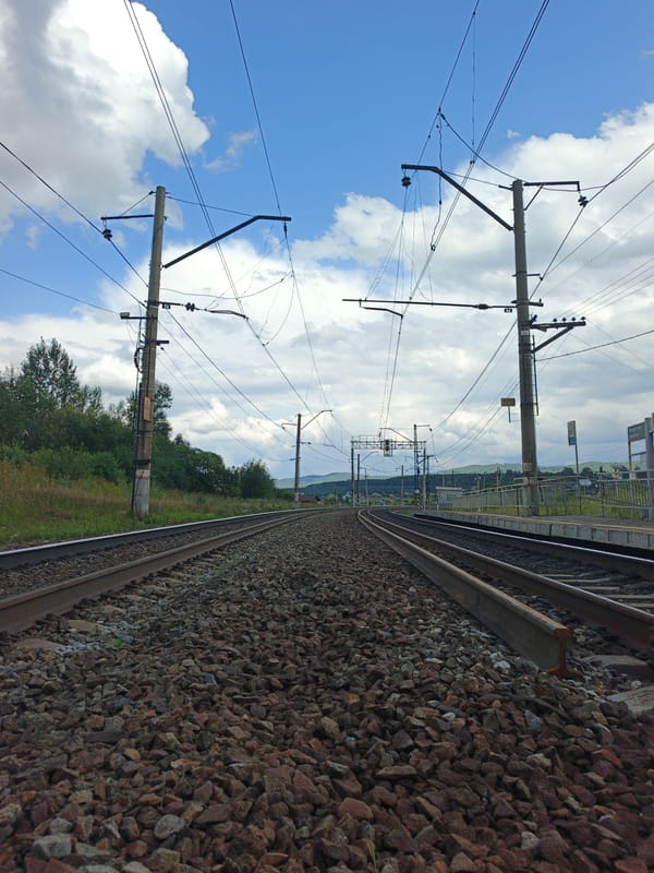 A quiet Russian village stop, storm clouds rolling in