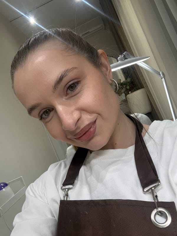 Woman captures selfies during sunny morning in Budva, Montenegro