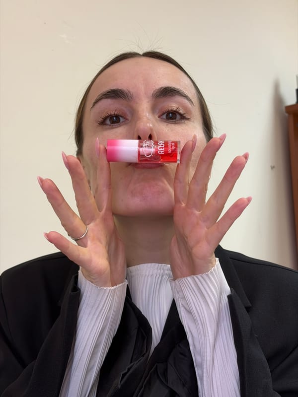 Woman displays lip oil product in Izhevsk, Russia
