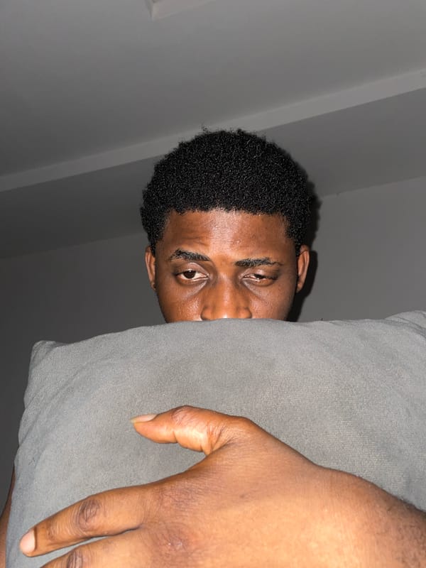 Man photographed peeking from behind fabric in Akwanga, Nigeria