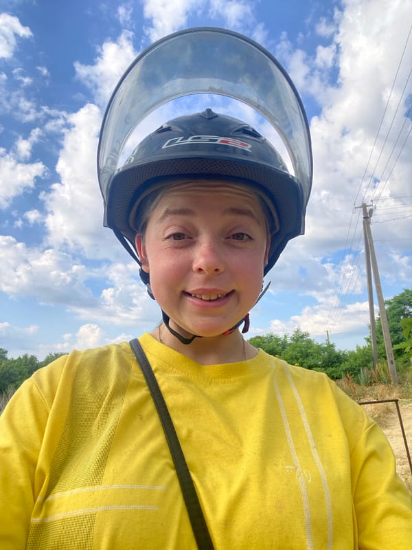 Helmet selfies and a red moped in Nova Praha
