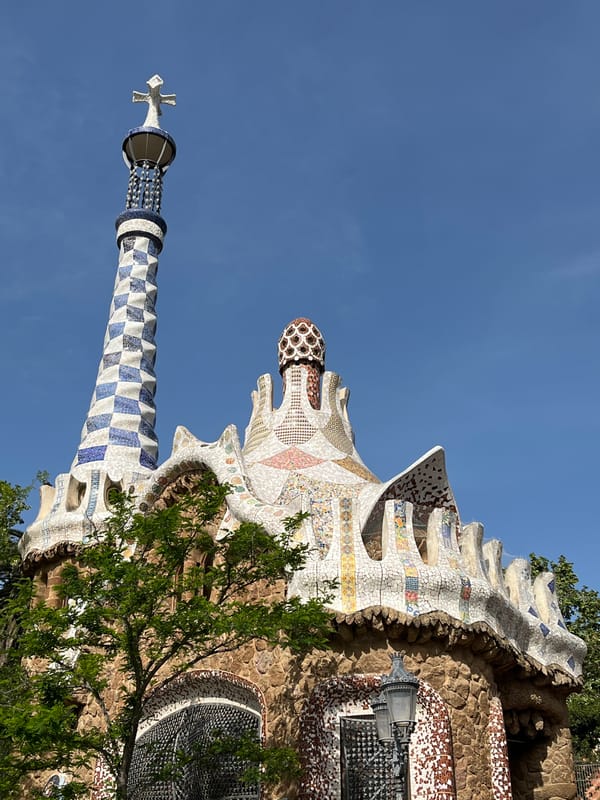 Morning visitors document Park Güell's iconic architecture in Barcelona