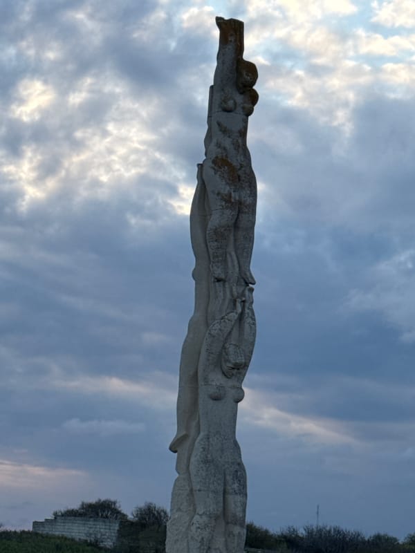 Tourist documents monument and scenic Black Sea overlook in Bulgaria