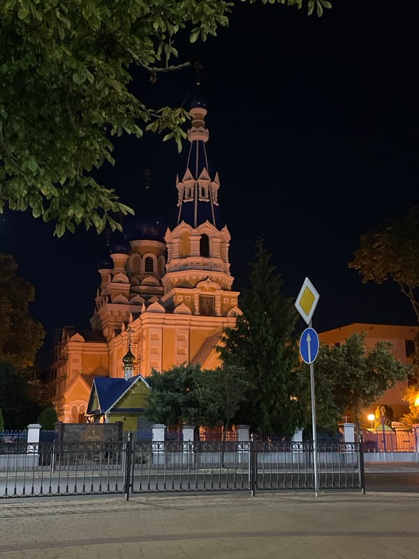 Brest city center at night, landmarks and lit walkways
