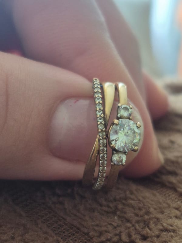 Woman displays gold rings during casual photo session in Tobolsk