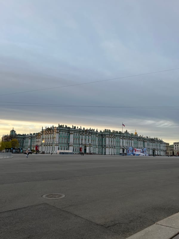 Street musician performs in decorated Palace Square, Saint Petersburg