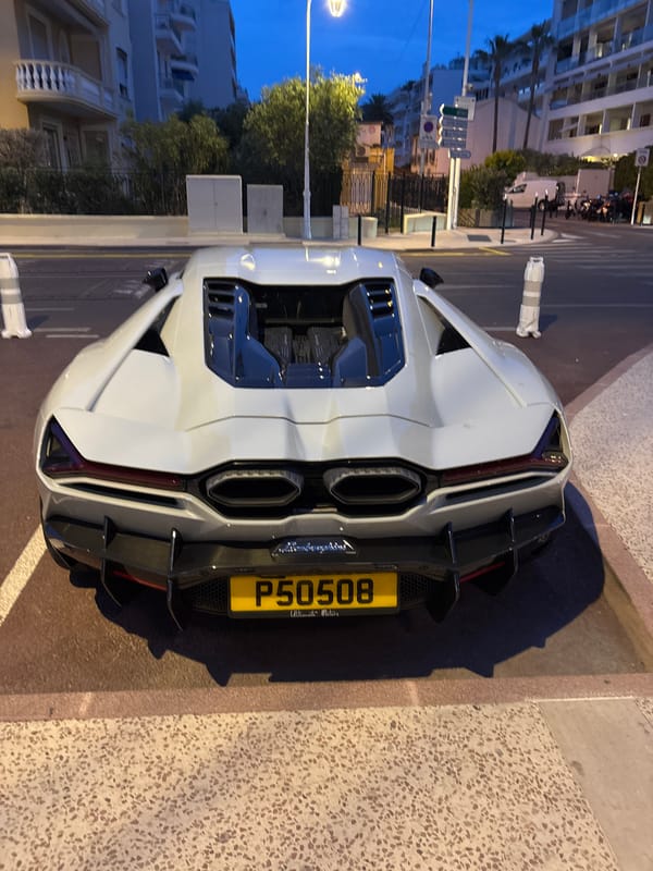 Upscale dining experience documented at Cannes restaurant with luxury car
