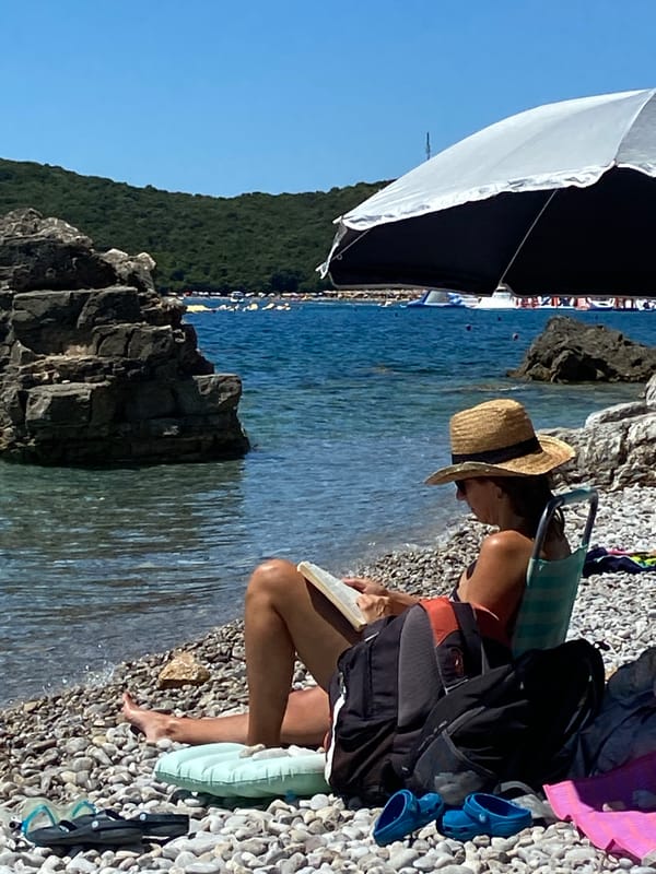 Summer day on the Montenegro coast — beach, boats, blue water