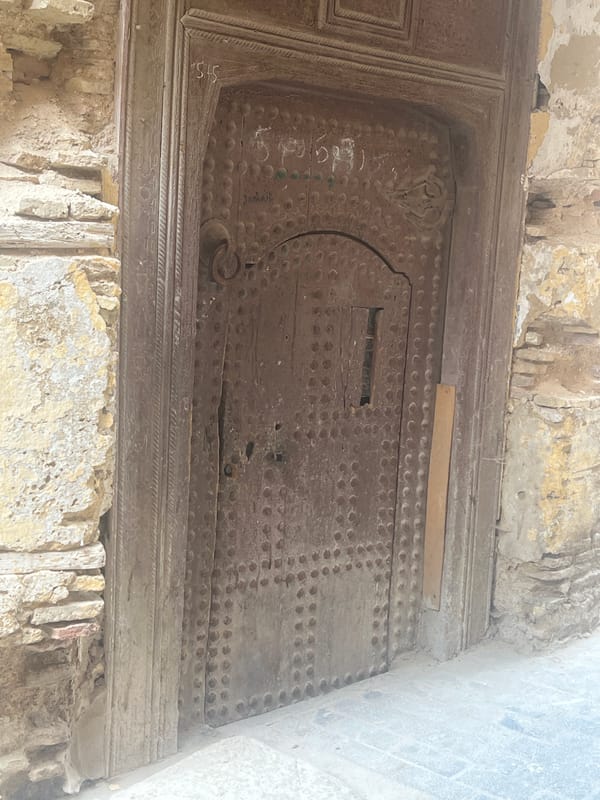 Historic ornate wooden door documented in Meknes, Morocco