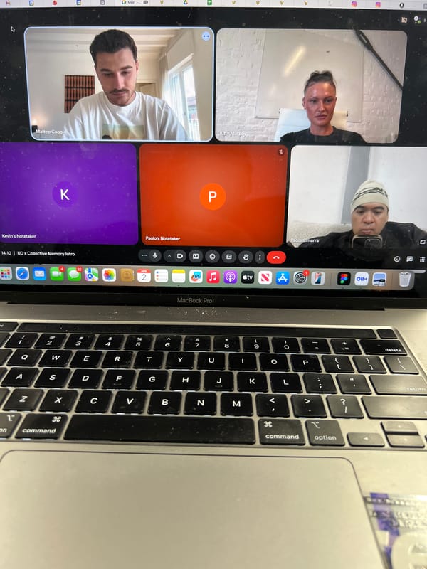 Four-person video conference call captured on laptop screen