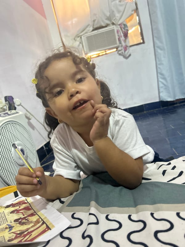 Child creates Egyptian artwork at Venezuelan preschool