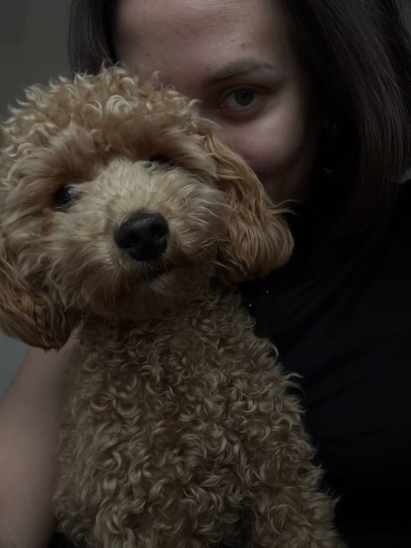 Woman takes selfies with poodle in Pervomaysky, Russia