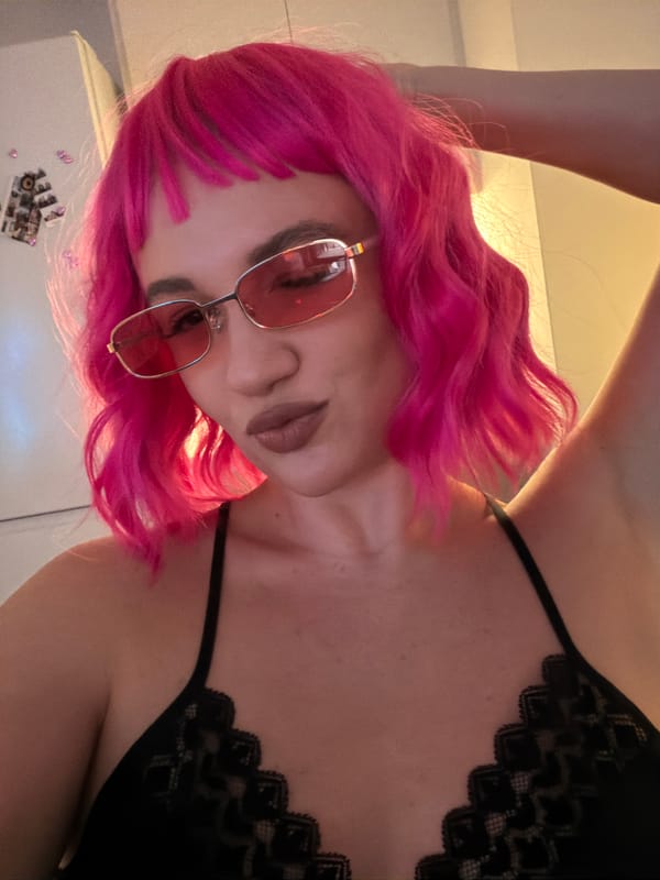 Person in fishnet stockings rests on couch in Belgrade