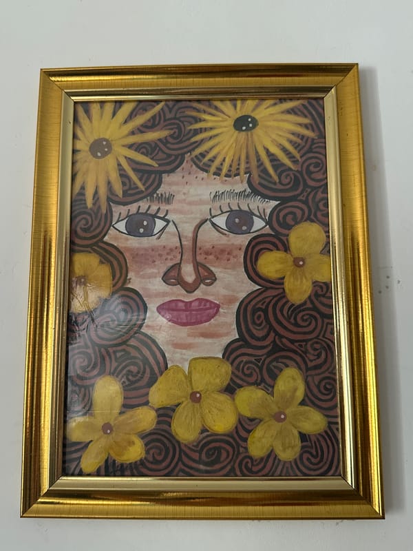 Stylized portrait paintings documented on gallery walls in Davao City