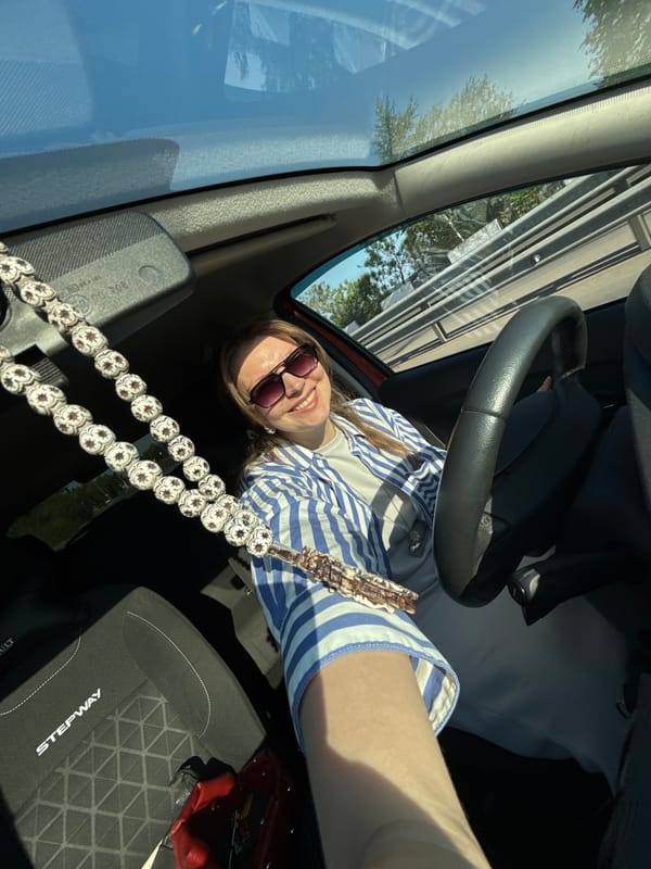 Woman takes selfie in car interior in Izhevsk