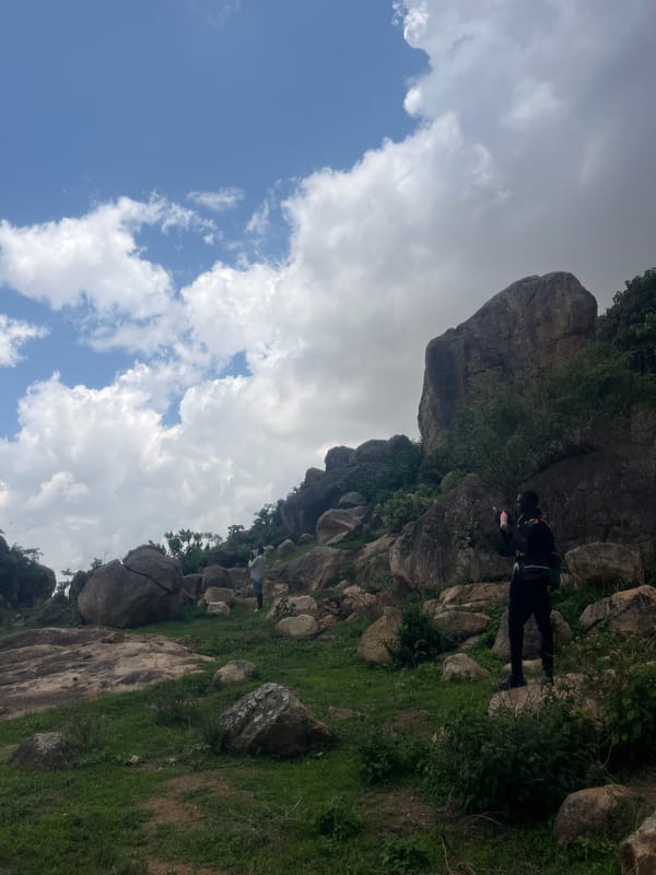 Daily life documented in rural Nigerian community amid rocky landscape