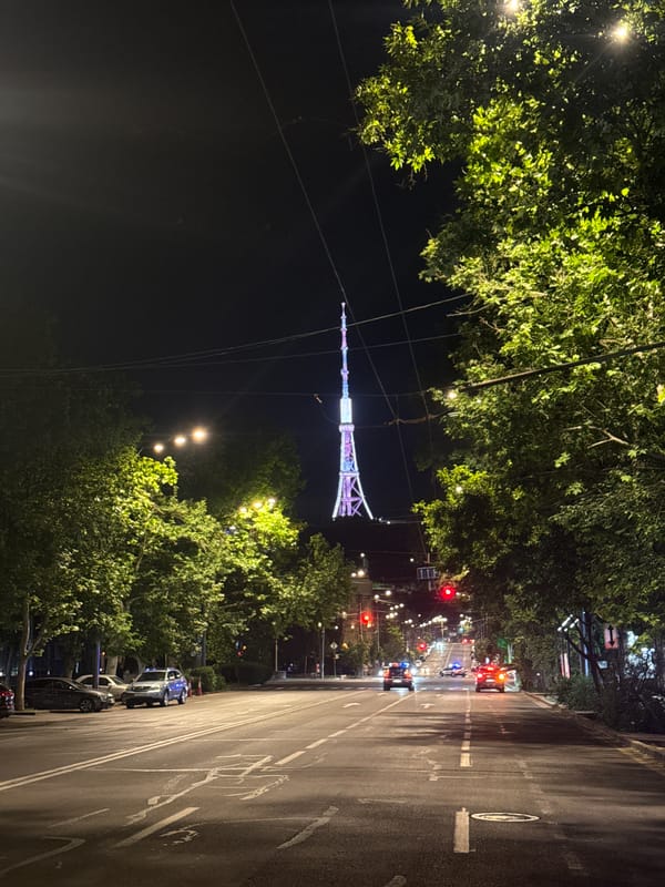 Illuminated Yerevan TV Tower captured in nighttime street view