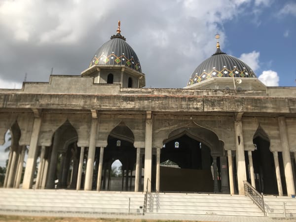 Mosque with geometric-patterned domes documented in Nicahawe, Indonesia