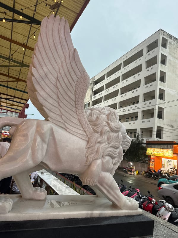 Morning street life documented around Nha Trang's winged lion statue