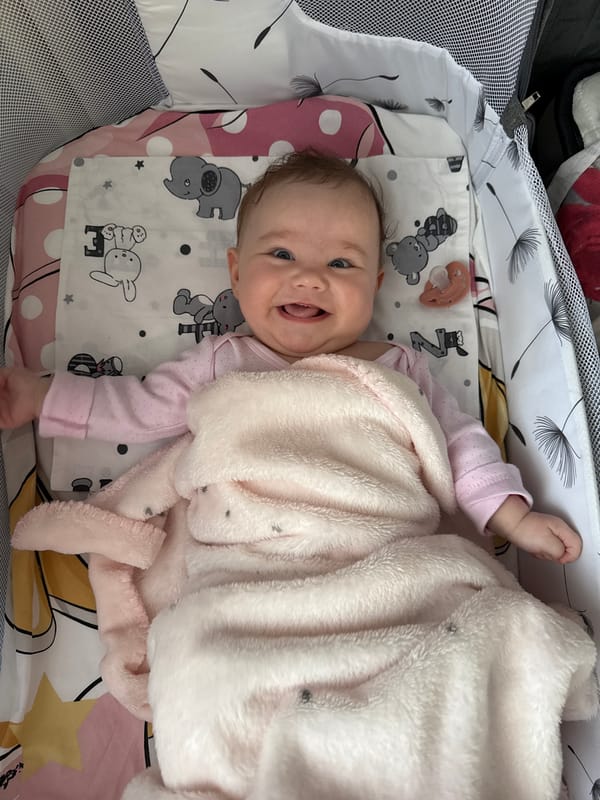 Baby observed smiling in cot in Pleven, Bulgaria