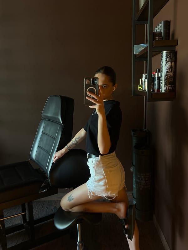 Mirror selfies inside a Ternopil tattoo studio