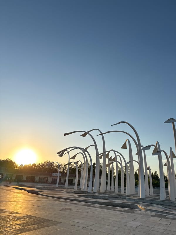 Tourist documents public art and coastal scenes in Taihe District