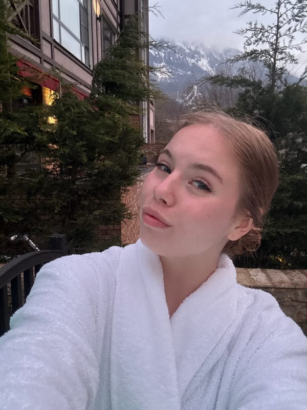 Woman photographed in Estosadok resort area amid mountain scenery