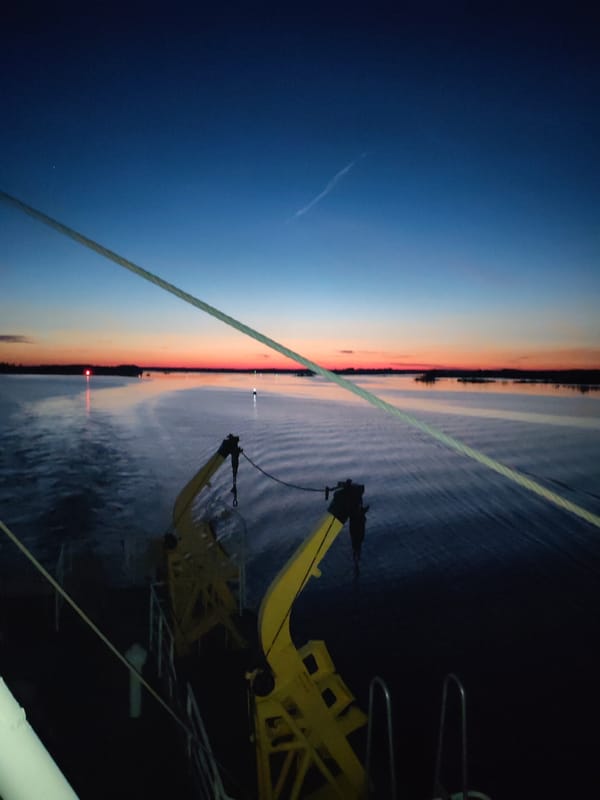 Vessel passenger captures sunset reflection over Russian waters