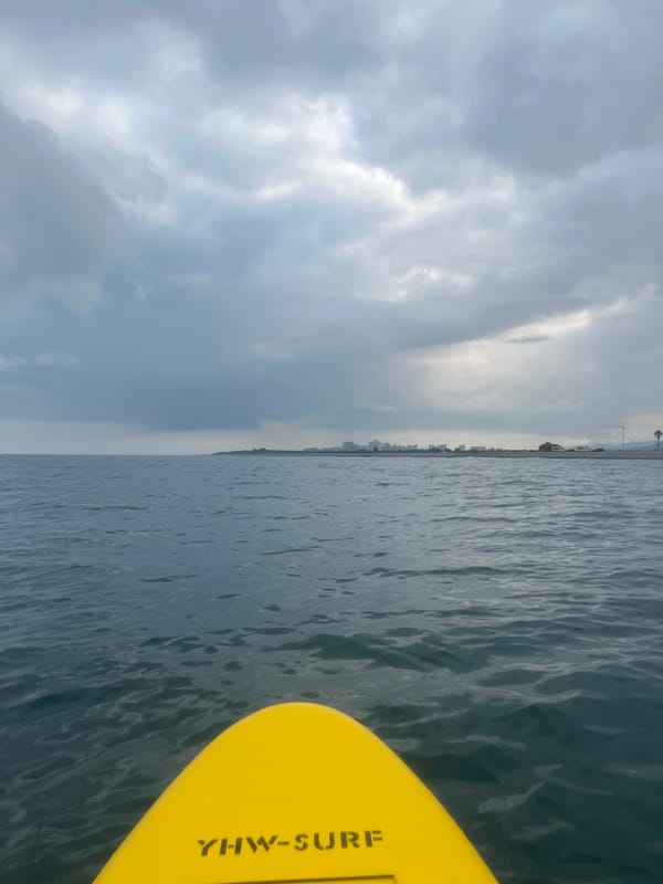 Paddleboarding off Batumi under a stormy Black Sea sky