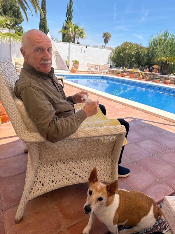 Elderly man relaxes poolside in Mont-roig del Camp, Spain