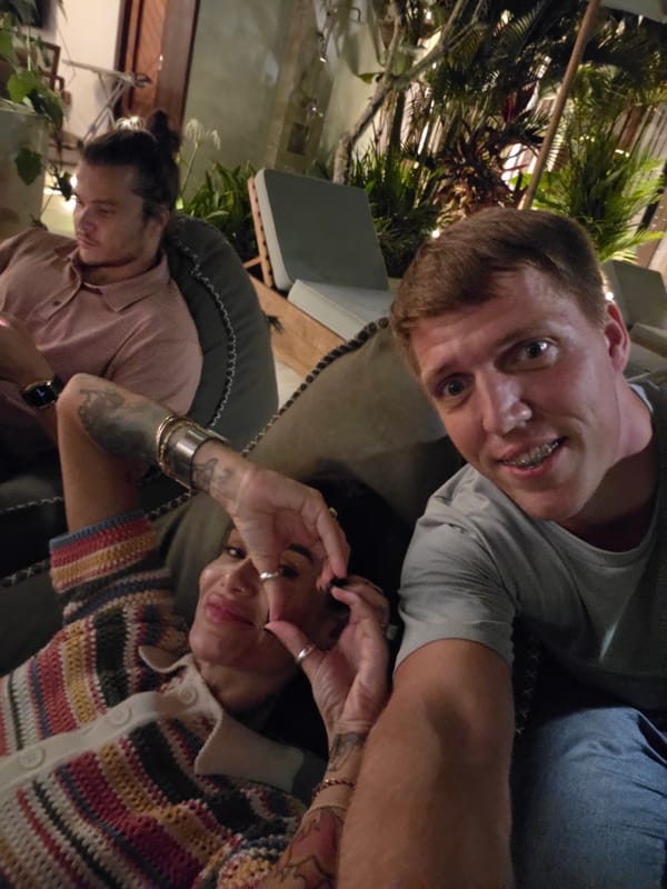 Tourist group documents social gathering through selfies in Ubud