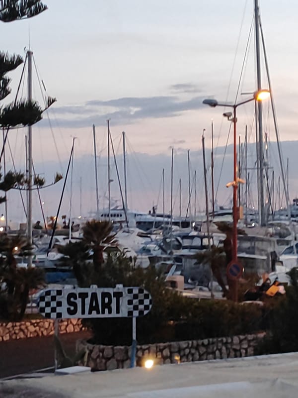 Luxury yachts dock at Sanremo marina during evening hours